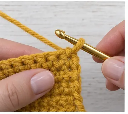 Old mustard yarn dropped before the final crochet pull through