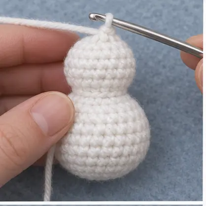 Completed one-piece white crochet snowman body and head
