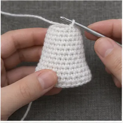 White crochet ghost body widening below the head