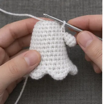 Small white arm crocheted directly onto the ghost body