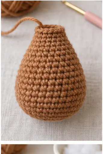 Pear shaped brown crochet body for a Highland cow