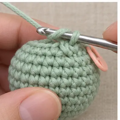 Completed invisible decrease blended into a mint amigurumi round