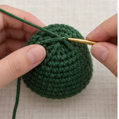 Red crochet bobble ornaments attached to a green Christmas tree
