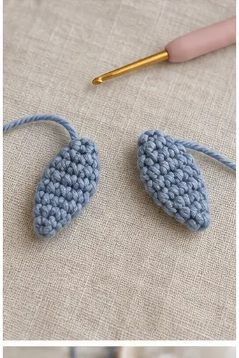 Two flattened crochet tail flukes for a mini whale