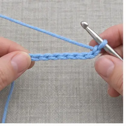 Blue foundation chain prepared for a straight-edge crochet swatch