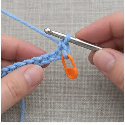 Orange marker placed in the first blue single crochet stitch