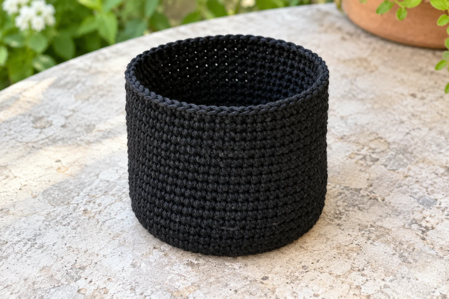 Black crochet pouch body before adding eyelets